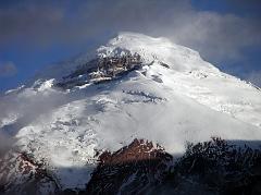 
As we drove to Tambopaxi, the clouds slowly lifted and Cotopaxi revealed itself just before sunset. Located about 75km south of Quito, Cotopaxi (5897m) is the second highest mountain in Ecuador, after Chimborazo. Cotopaxi has an almost symmetrical cone that rises from a highland plain of about 3800m, with a width at its base of about 23km. It has one of the few equatorial glaciers in the world, starting at 5000m.
